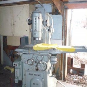 Abrasive surface grinder